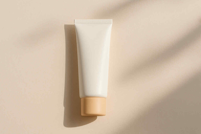 Minimalist sunscreen tube on a beige background, illustrating the Thank You Farmer Water Sun Cream review.